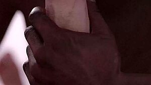 Black guy eagerly sucks huge white cock in intense blowjob.