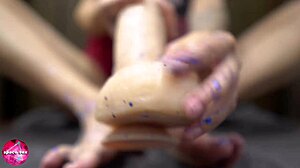 I give a sensual footjob to the rubber cock.