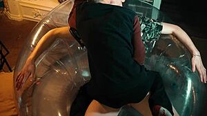 Two sweet guys share an inflatable chair, relaxing together in a casual setting