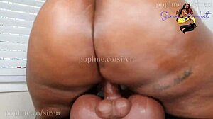 ebony with big ass riding big thick torso, using buttplug for solo fun.