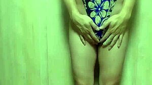 gorgeous gold leotard babe trains with long anal plug, wow!