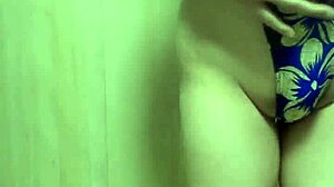 gorgeous gold leotard babe trains with long anal plug, wow!