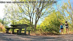 What happens at this public outdoor picnic with amateurs in shorts showing natural tits?