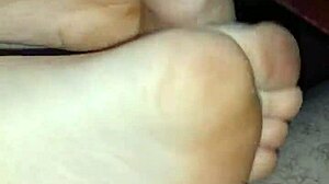 Homemade bare footjob with stockings, pantyhose, and toes for a big cumshot