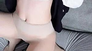 this asian milf in transparent stockings seduces with her big tits