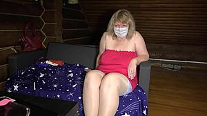 Mature housewife teases on webcam, showing off chubby curves and nylon-clad feet in stockings