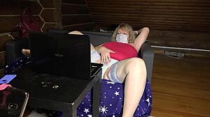 Mature housewife teases on webcam, showing off chubby curves and nylon-clad feet in stockings