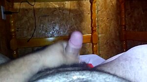 Masturbating on the bed.