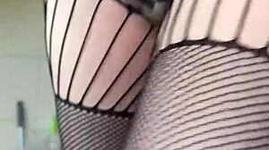 Brunette in fishnets starts a sexy fetish workout with athletic moves. Her small tits bounce during intense action.