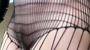 Brunette in fishnets starts a sexy fetish workout with athletic moves. Her small tits bounce during intense action.