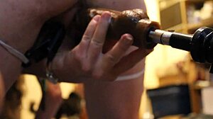 fuck machine pounds wet pussy close-up with dildo