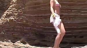 Little Summer flashes natural tits and pussy on the beach for fun.