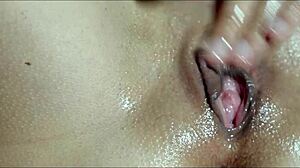 He massages my wet pussy with oil until I cum in close-up