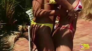 Two busty tattooed blondes finger and lick pussy to orgasm in pool