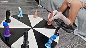 petite stepsister earns her orgasm with wheel of dildos game