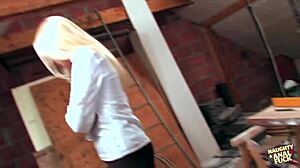 French woman uses hands to handle large object intriguingly