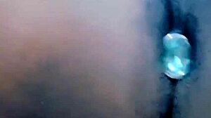 Huge dildo fucks small cock in chastity cage during anal missionary