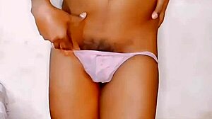 Huge dildo fucks small cock in chastity cage during anal missionary