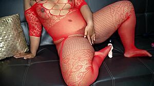 ebony girl feels dissatisfied with her wet shaved pussy so she grabs big tits and masturbates hard with redhead dildo