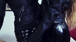 Detailed leather-clad lesbian threesome sex at the office with group action