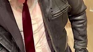 Men in leather suits play at the office