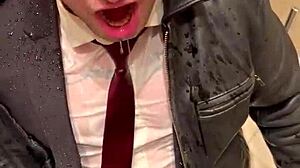 Men in leather suits play at the office