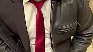 Men in leather suits play at the office