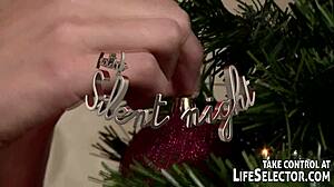 Lexi Lowe and her lesbian girlfriend engage in playful pillowfight under christmas tree