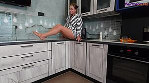Mature redhead Iris teases legs and feet in tan pantyhose.