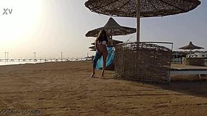 hey, i'm flashing my big tits and going pantyless on this public beach