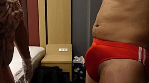 femdom bitch slaps erect cock over bloomers