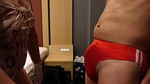 femdom bitch slaps erect cock over bloomers