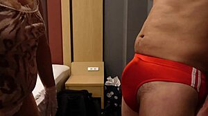 femdom bitch slaps erect cock over bloomers