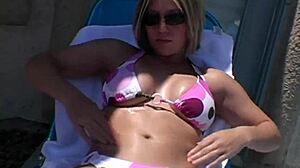 Paige Applies Lotion Outdoors Under Sunshine