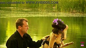 Lovely couple in stockings gives blowjob and bangs outdoors on small boat in lake