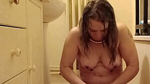 Female slave in bdsm self-session with chains