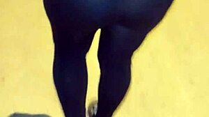 Mature woman with huge ass in transparent leggings walks the street