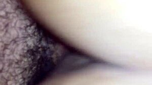 Bent over in doggystyle position, contrasting pleasure and submission