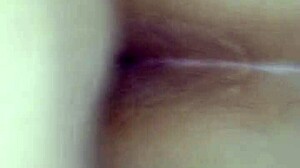 Bent over in doggystyle position, contrasting pleasure and submission