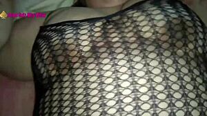 Feeling intense pleasure while fucking in fishnet lingerie.