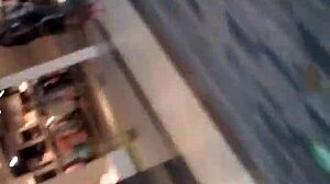 Hidden in the shop, she folds her ass for the voyeur