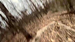 Teen strips naked and fucks in forest