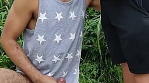 In the field, she sucked the endowed farmer while his friend filmed the public act.