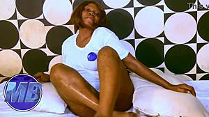 hey check out this sexy ebony with huge tits getting oiled for barefoot fucking and orgasm