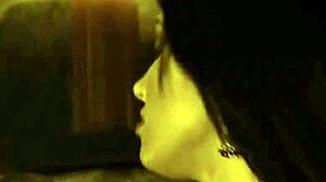 Beautiful brunette undresses gracefully in an erotic dance