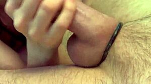 giving a handy handjob to this big cock up close