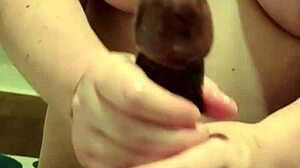 Big titty white girl casually gives handjob