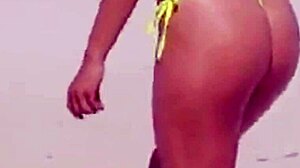 Awesome young girl in micro bikini on the beach with relatives