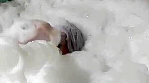 Cyno enjoys a suggestive bubble bath in cosplay costume