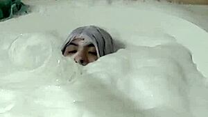 Cyno enjoys a suggestive bubble bath in cosplay costume